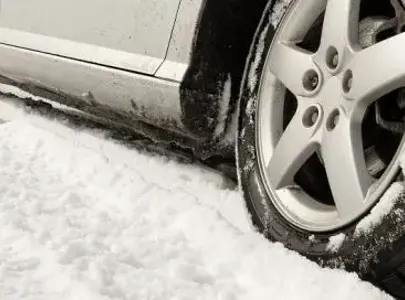 rear car wheel in the snow.