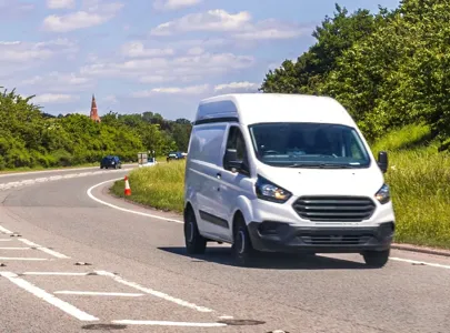 White van travelling on the road