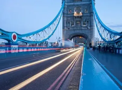 Tower Bridge in London, England, UK, illuminated at dusk, showcasing its iconic architecture.