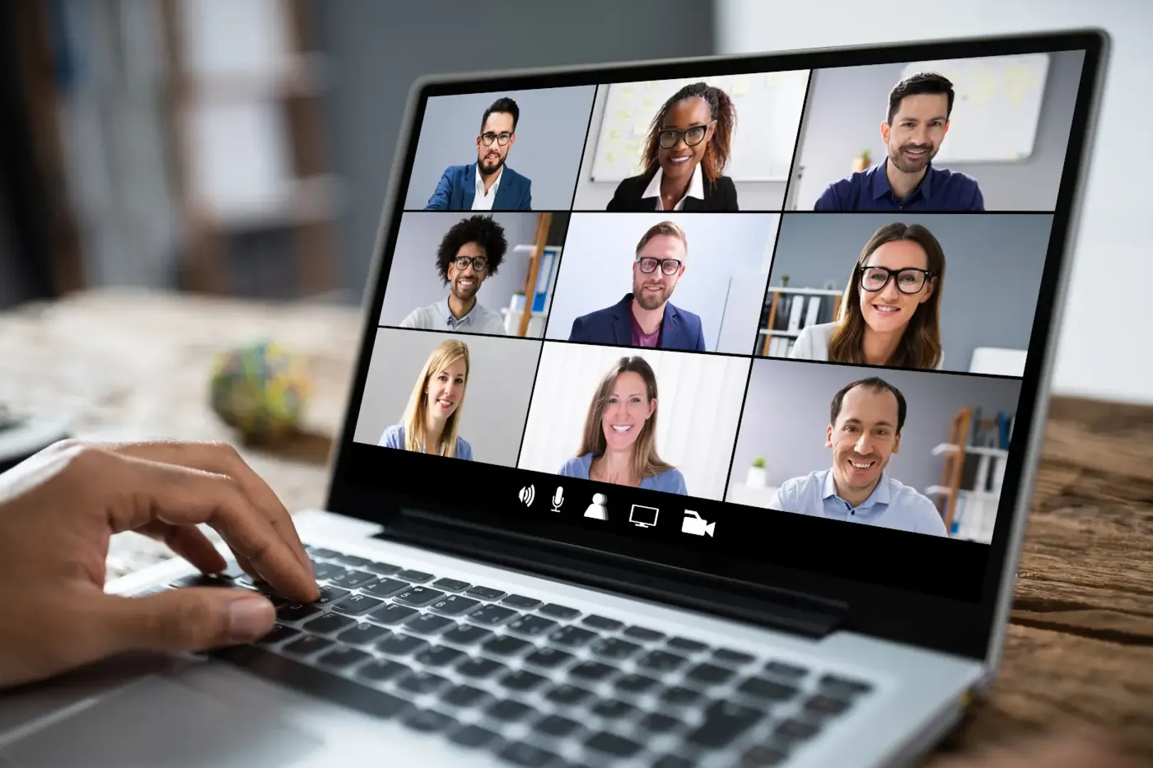 Individual on laptop in video call.
